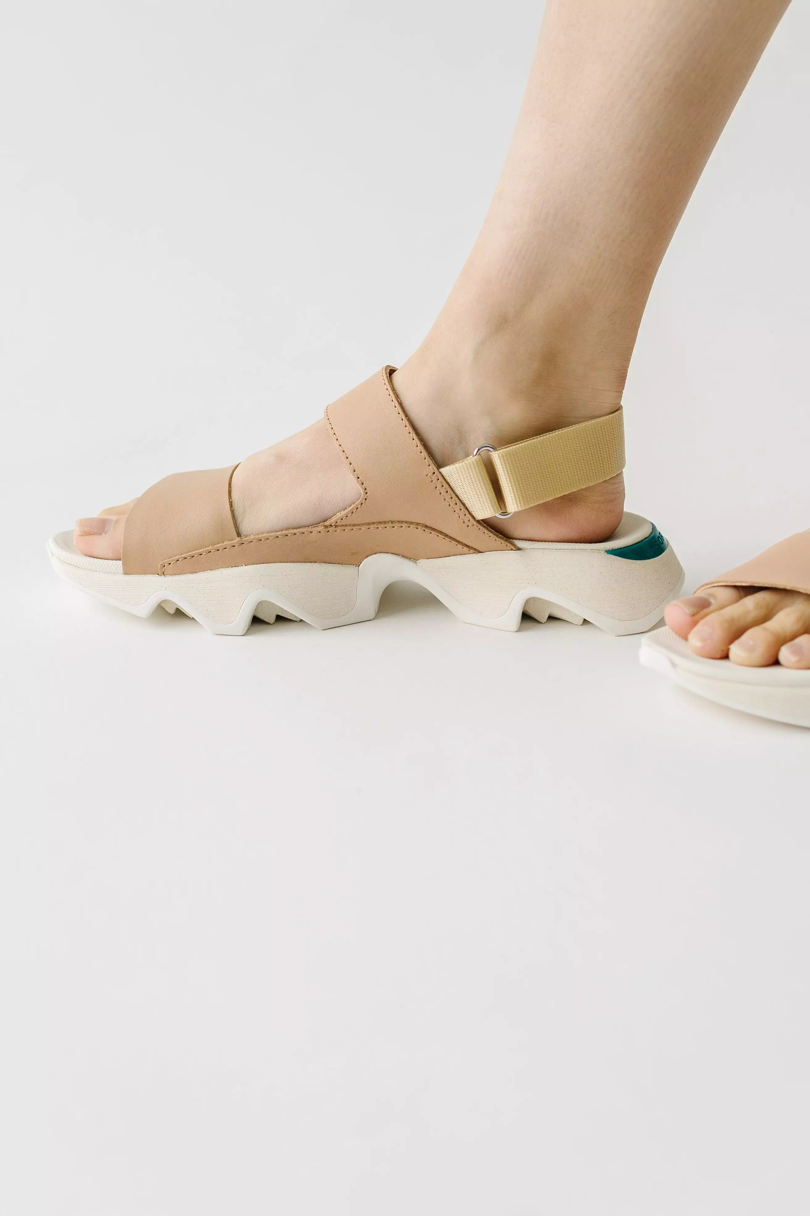 SOREL: Kinetic Impact II Sling Low Sandal in Honest Beige + Sea Salt